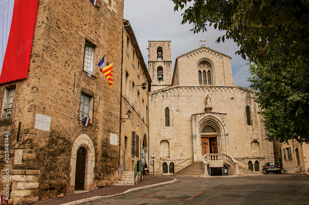 Street view with old church and building in the city center of Grasse, known for producing perfumes. Located in the Alpes-Maritimes department, Provence region, southeastern France