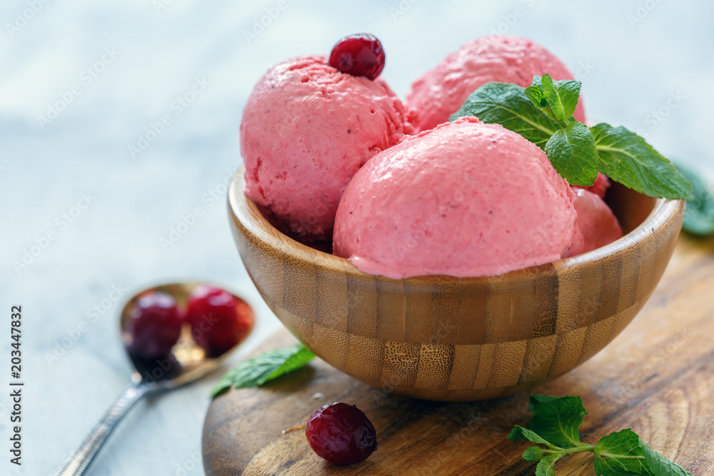 Natural cranberry ice cream in a wooden bowl. Natural cranberry ice cream in a wooden bowl.