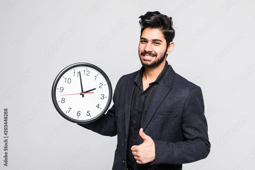 Portrait of a indian business man with clock isolated on white background Portrait of a indian business man with clock isolated on white background