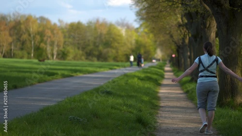 Wallpaper Mural a young mother walks with a baby with a sling Torontodigital.ca