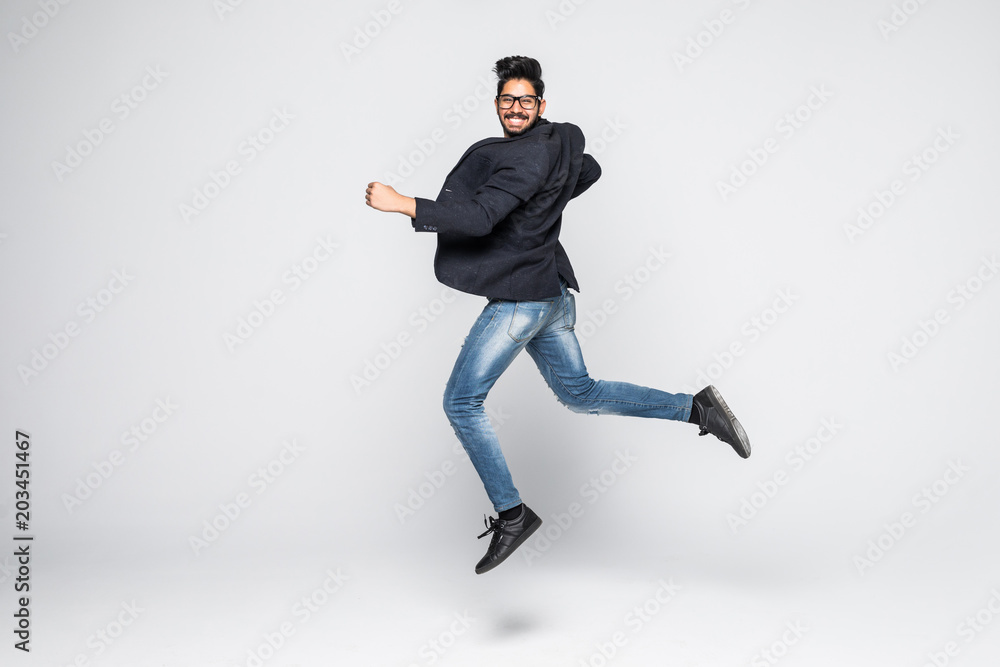 Excited Indian businessman jumping for joy isolated on white background. Excited Indian businessman jumping for joy isolated on white background.