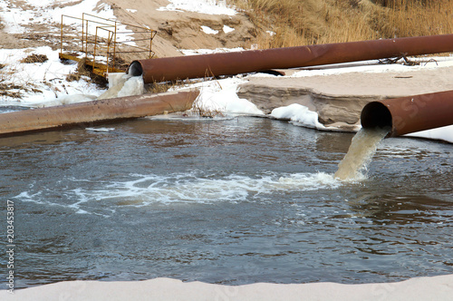 Sewer pipe into the sea. The dirty drain waste water. Environmental pollution.