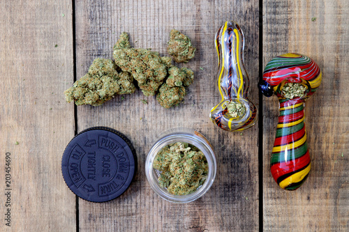 Marijuana with Two Colorful Pipes, Overhead (Sativa Dominant Hybrid, Green Crack Strain) photo