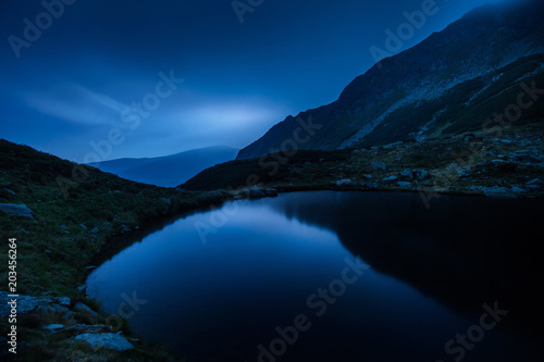 Mountain lake landscape at night