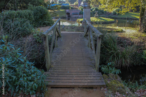 Wooden footpath bridge crossing a stream