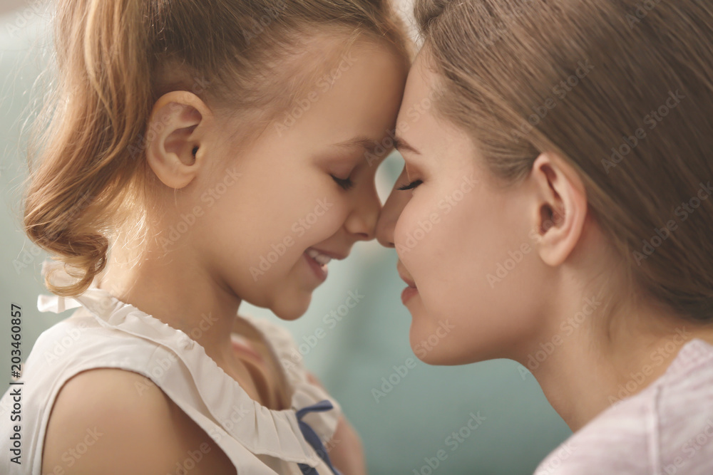 Portrait of happy mother and daughter at home, closeup Portrait of happy mother and daughter at home, closeup