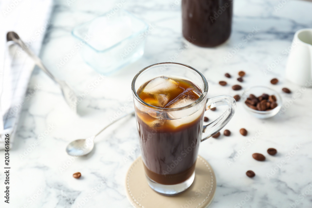 Glass cup with cold brew coffee on light background Glass cup with cold brew coffee on light background