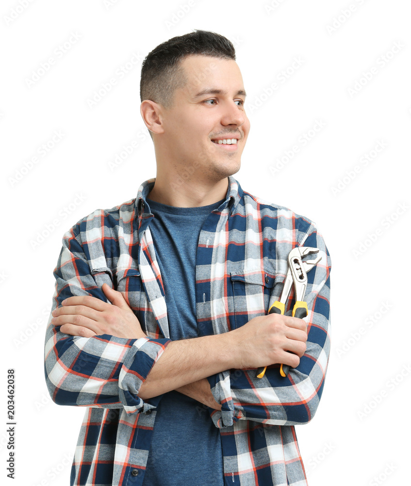 Young plumber with adjustable wrench on white background Young plumber with adjustable wrench on white background