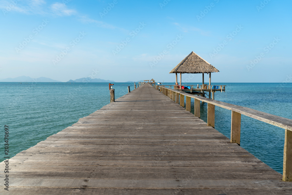 Wooden pier between sunset in Phuket, Thailand. Summer, Travel, Vacation and Holiday concept.
