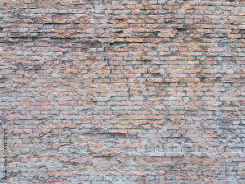 Texture of red brick wall, rough surface after war.