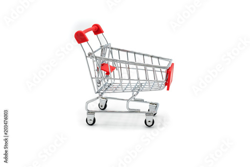 Empty shopping cart trolley isolated on white backgrounds © PORNCHAI SODA