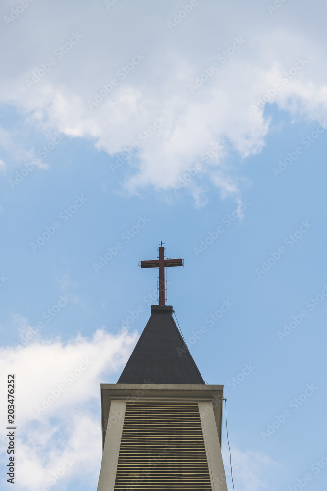 A cross on top of a church tower