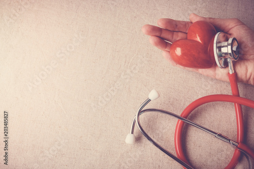 red heart with stethoscope, heart health, health insurance concept