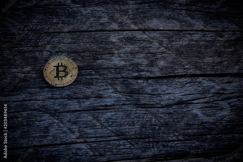 Bitcoin laid on old wooden floor. Bitcoin laid on old wooden floor.