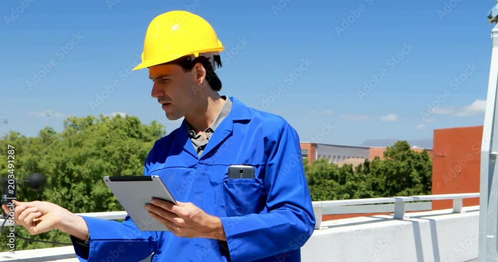 Male worker working at solar station Male worker working at solar station
