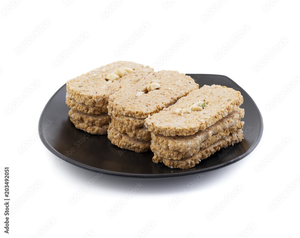 Indian Sweet Gud Kaju Gajak Isolated on White Background Indian Sweet Gud Kaju Gajak Isolated on White Background