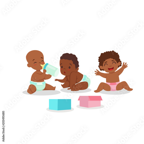 cute african american babies playing and drinking
