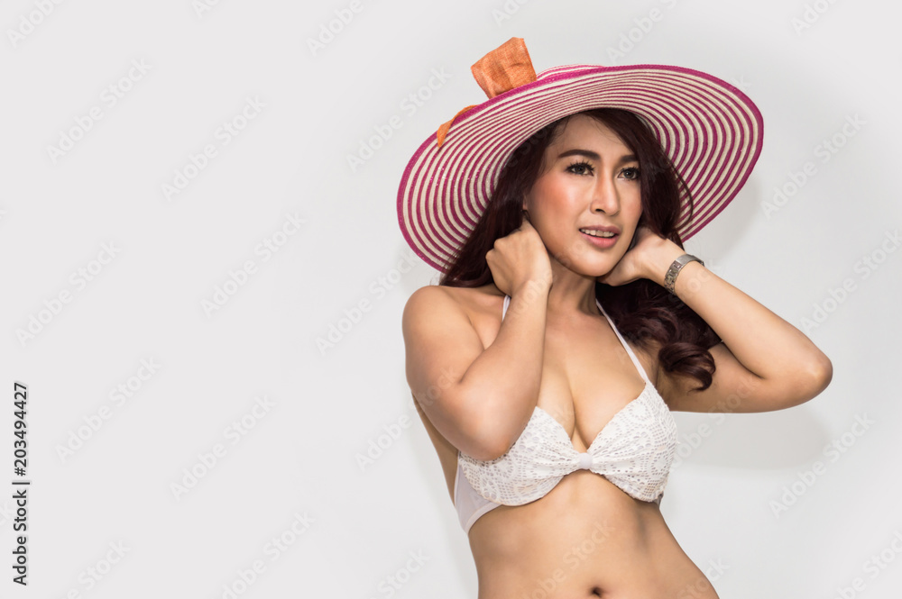Woman in sexy swimsuit poses in bedroom. Woman in sexy swimsuit poses in bedroom.
