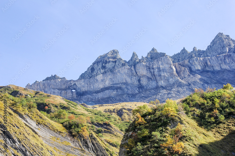 Martinsloch, Canton Glarus, Switzerland. It is a breakthrough in the Alpine chain of the Tschingelhoerner s in the form of a triangle about 6 meters wide and about 18 meters high.