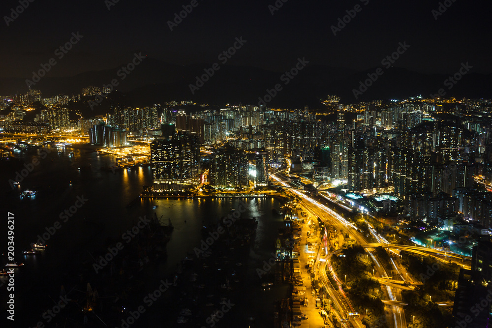Kowloon and Hong Kong harbour aerial view at night