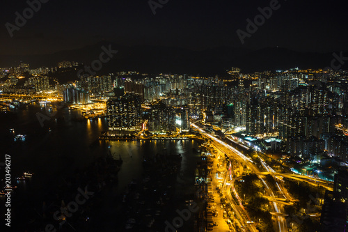 Kowloon and Hong Kong harbour aerial view at night