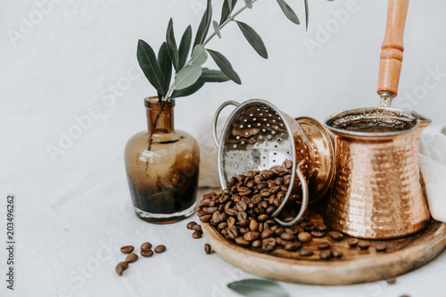 Arabic coffee pot with beens. Rural scene