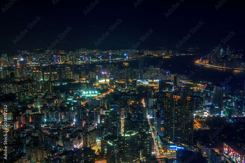 Cityscape of Kowloon with colourful lights in futuristic style Cityscape of Kowloon with colourful lights in futuristic style