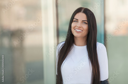 Fashion lifestyle portrait of young happy pretty woman laughing and having fun on the street at nice sunny summer day. portrait of young pretty stylish girl with long hair. Free Download Fashion lifestyle portrait of young happy pretty woman laughing and having fun on the street at nice sunny summer day. portrait of young pretty stylish girl with long hair. - GFXLoad