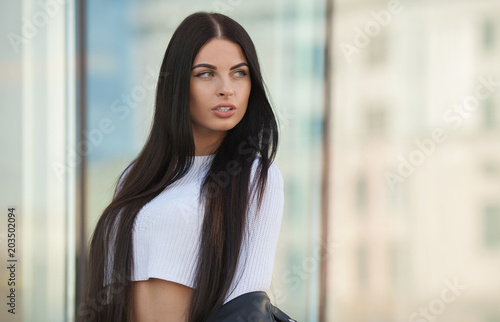 Free Download Fashion lifestyle portrait of young happy pretty woman laughing and having fun on the street at nice sunny summer day. portrait of young pretty stylish girl with long hair. - GFXLoad
