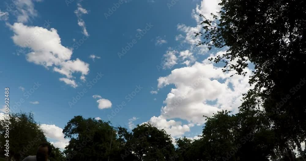 Time-Lapse White Cumulus Clouds Moving In Blue Sky Time-Lapse White Cumulus Clouds Moving In Blue Sky