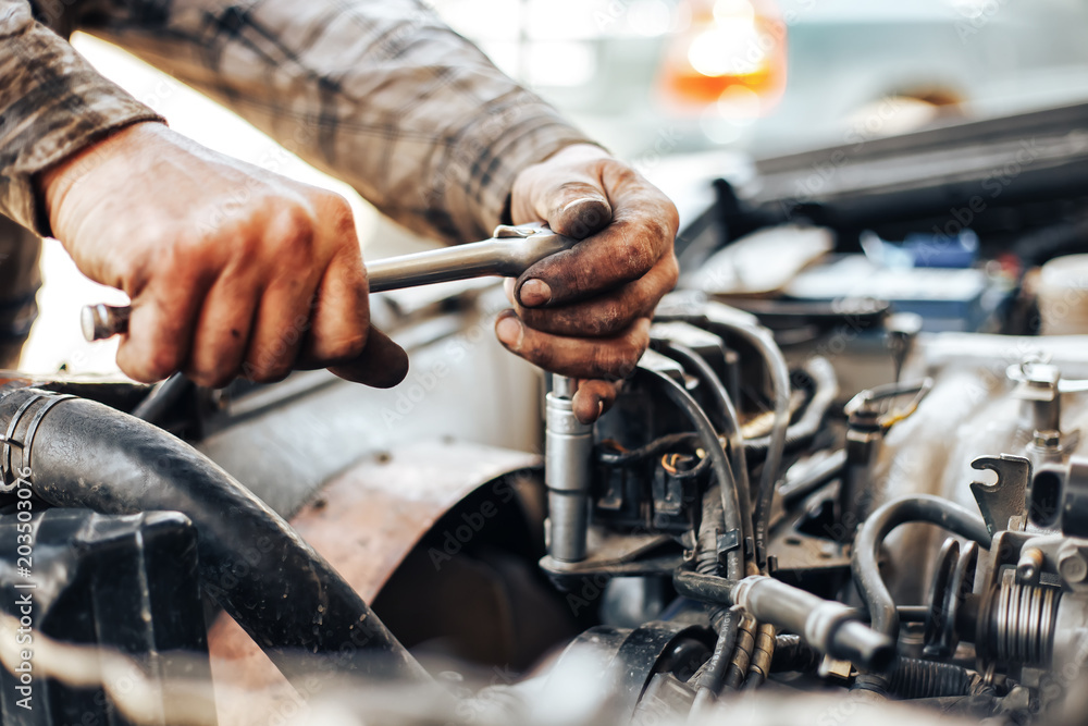 dirty hands of auto mechanic reparing car dirty hands of auto mechanic reparing car