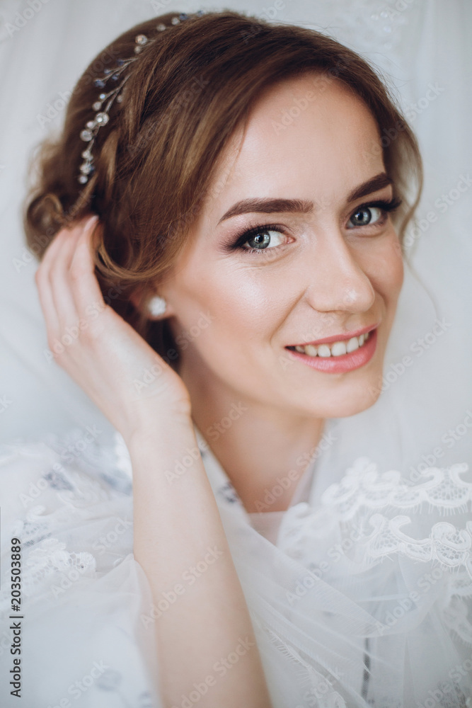 Face closeup of gorgeous bride with makeup and veil, beautiful bride portrait the morning before the wedding Face closeup of gorgeous bride with makeup and veil, beautiful bride portrait the morning before the wedding