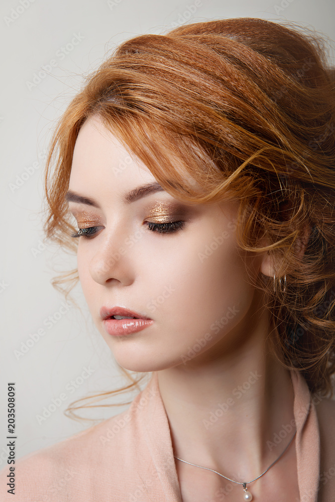 Red-haired girl with a hairstyle Greek braid and make-up on closed eyes on  a white isolated background close-up. Stock Photo | Adobe Stock