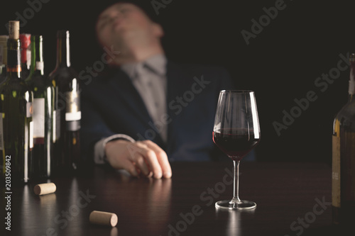 Businessman drunk by wine. Elegant alcoholic.