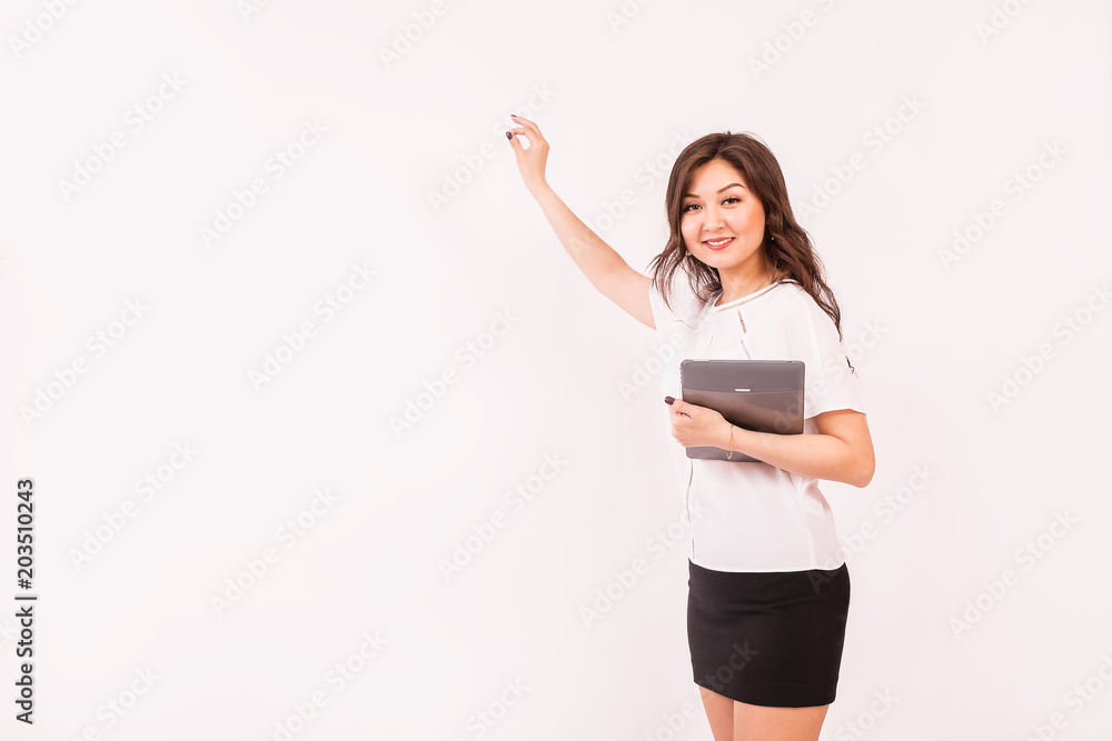 A girl of Asian appearance holds a presentation. The style of the modern business woman. A girl of Asian appearance holds a presentation. The style of the modern business woman.