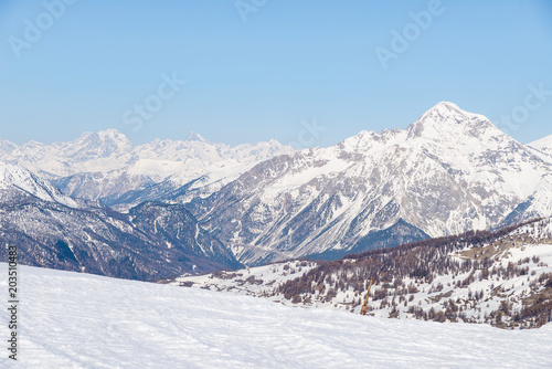 Panoramic view of Sestriere ski resort from above, famous travel destinatio in the Alps, Piedmont, Italy. © fabio lamanna