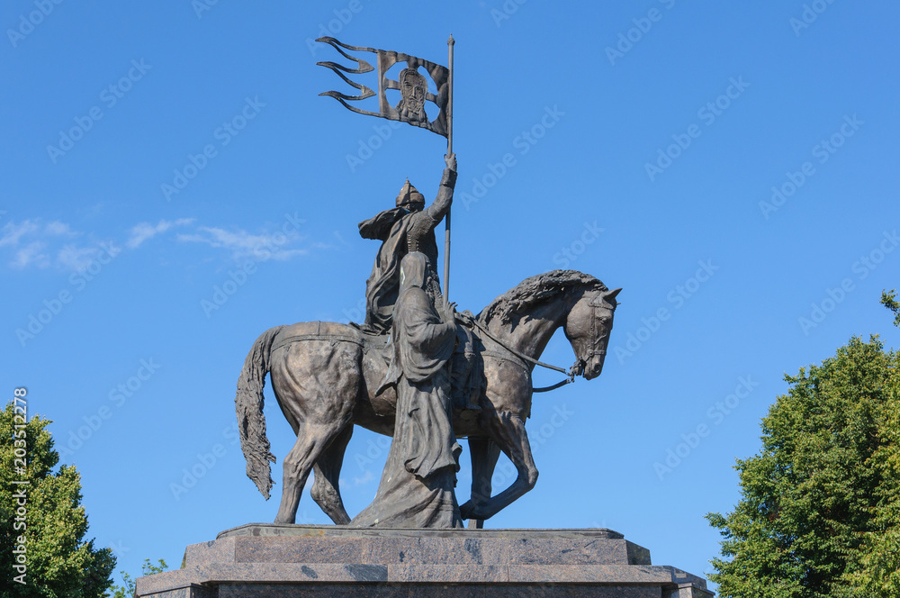 Obraz premium bronze statue of Prince Vladimir on a horse with flag and St. Theodore. the Golden ring of Russia