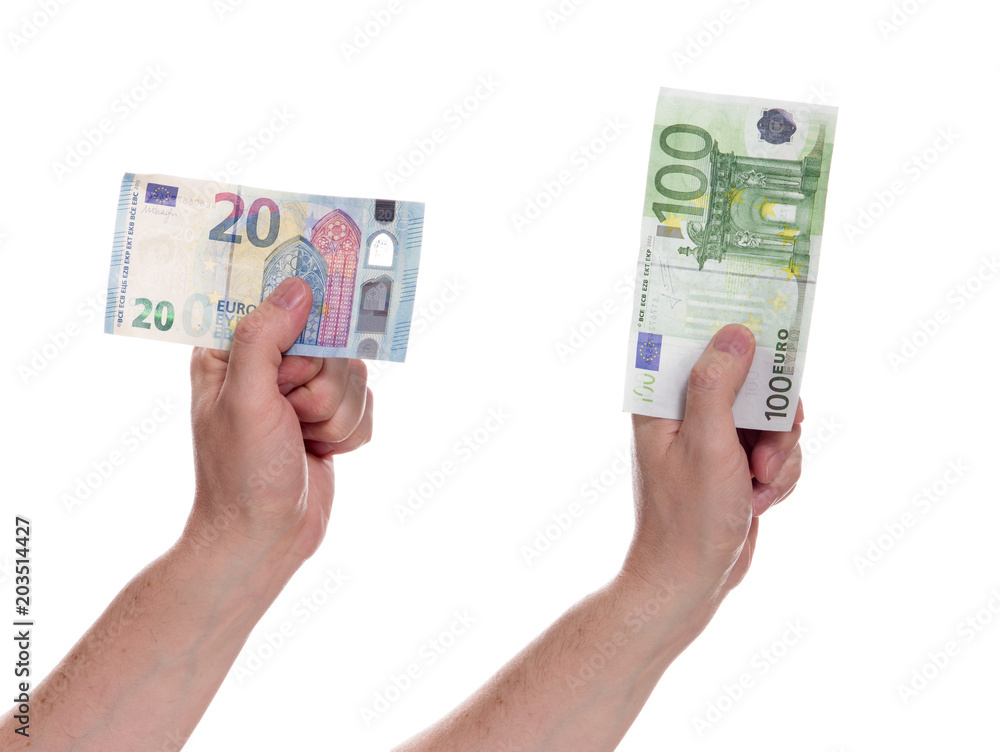 Euro money in hands on a white background. A man's hand holds twenty and one hundred euro notes. Euro currency. Euro money in hands on a white background. A man's hand holds twenty and one hundred euro notes. Euro currency.