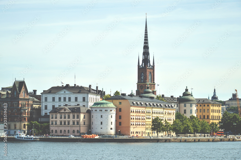 Cityscape view of Stockholm’s old town in famous Gamla Stan area densely situated by archaic buildings influenced by North German architecture