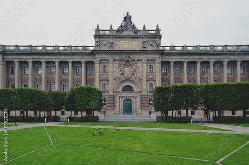 Building of The Parliament House of Sweden built in Neoclassical style, with a centered Baroque Revival style facade section in the Gamla stan, old town of Stockholm