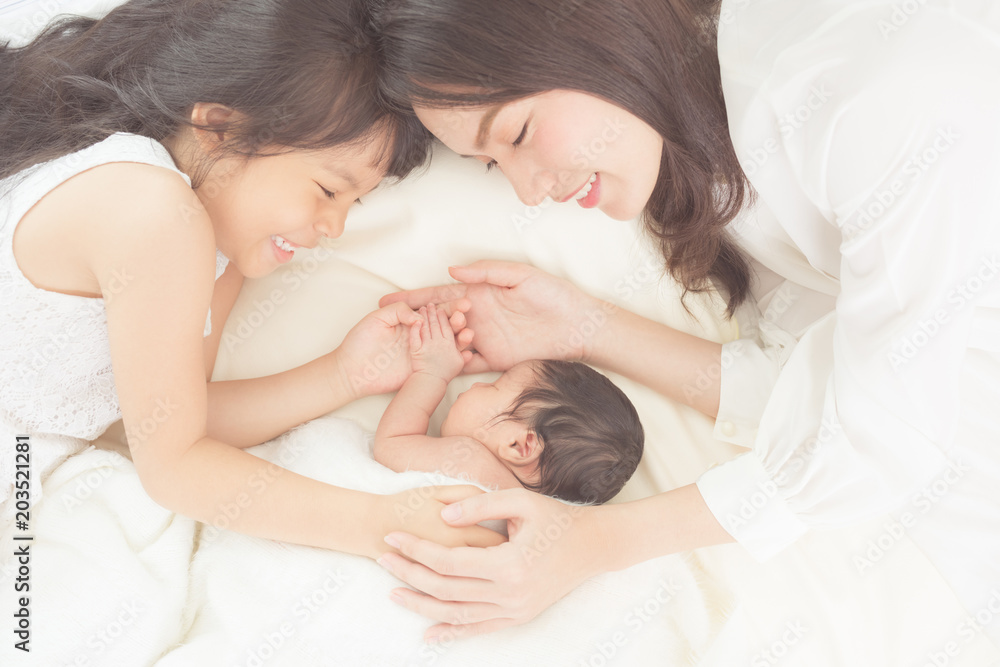 mother and children newborn and older sister. happy family. mother and children newborn and older sister. happy family.