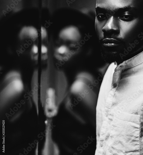 Modern black man and caucasian woman in a town.