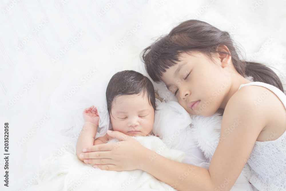 cute big sister with new newborn baby cute big sister with new newborn baby