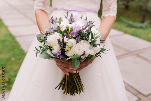 Wedding dress, wedding rings, wedding bouquet