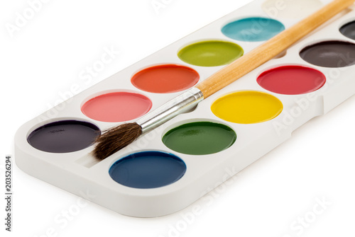 colored paints box with brush