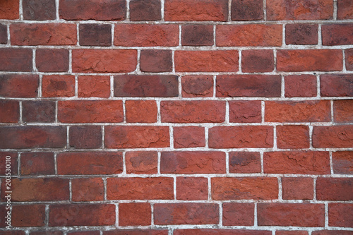 old wall of red threadbare brick