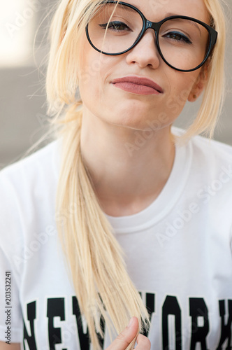 Outdoor portrait of young stylish hipster girl. photo