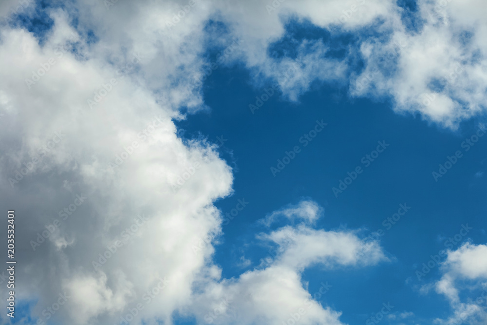 Background of transparent white clouds in a light blue sky