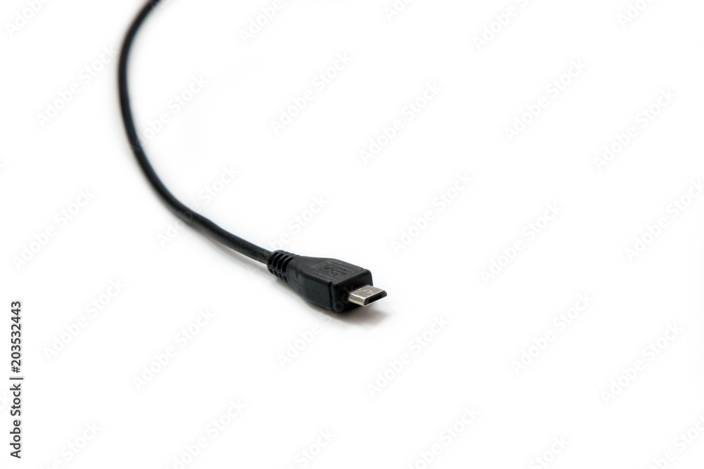 Black USB mini cable on white background. Connector close-up. Black USB mini cable on white background. Connector close-up.