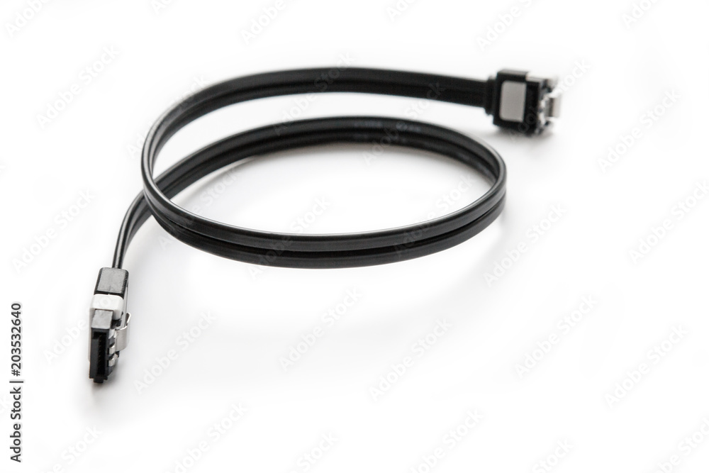 Black SATA cable for connecting a hard drive to the motherboard on a computer on a white background. Black SATA cable for connecting a hard drive to the motherboard on a computer on a white background.